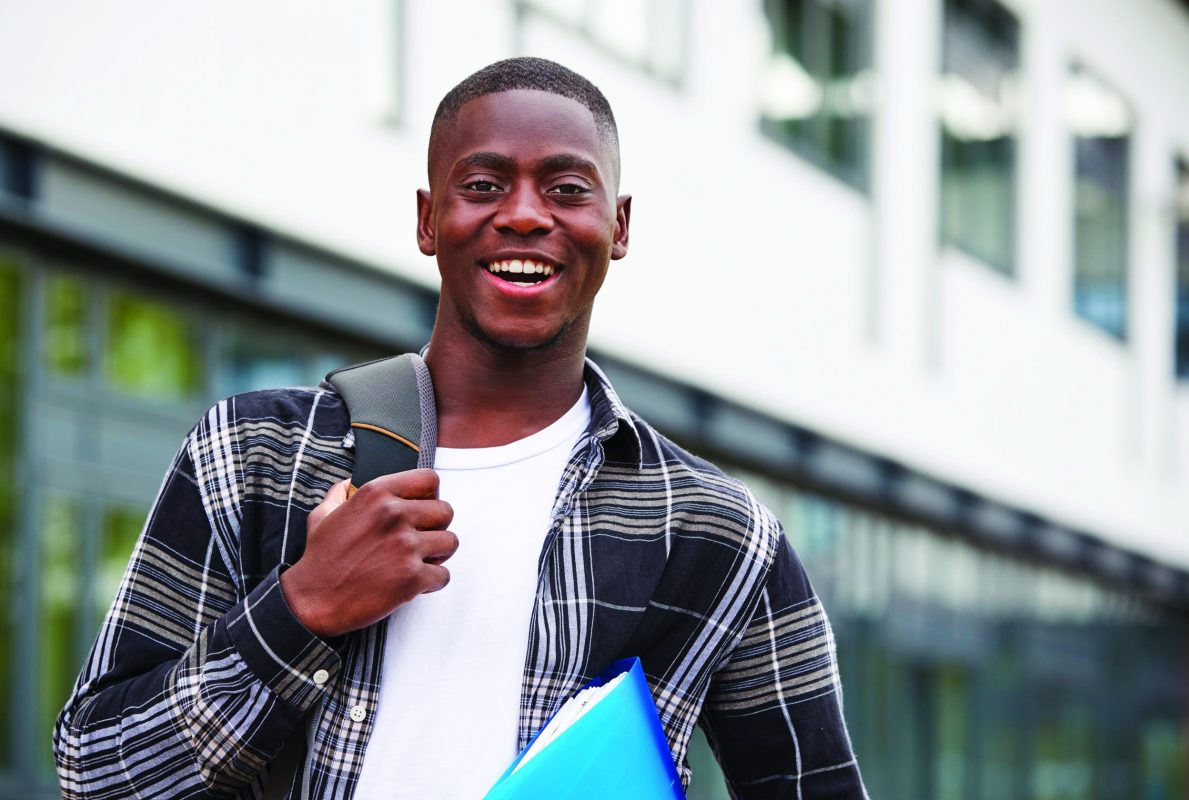 Portrait Of Male Student Standing Outside College Building