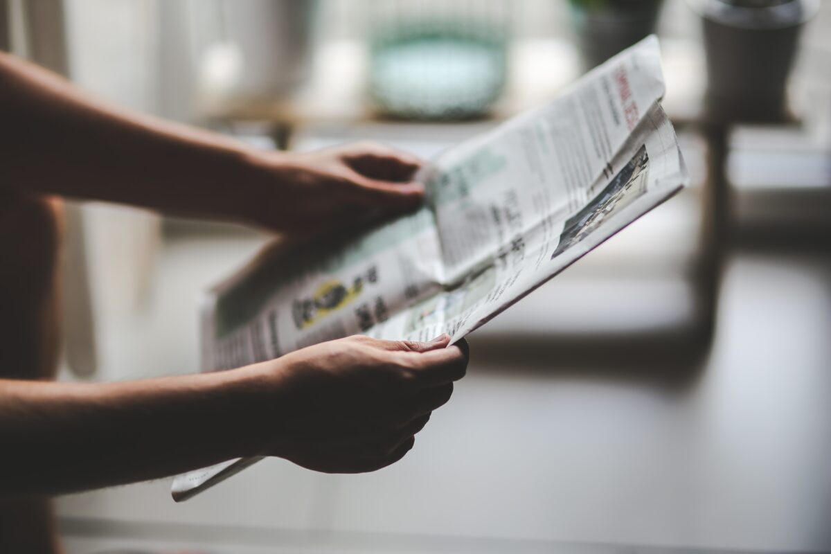 Person reading a newspaper