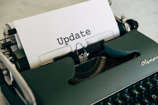 Typewriter with paper with the message "update"